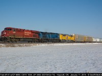 A colorful CP Train #141 rolls along just west of Haycroft, Ontario on January 17, 2018.  Consist today is CP 8880, CEFX 1034, and Union Pacific 3002, an SD70Ace-T4 and former EMDX Demonstrator 1504.  Nice to get these colorful consists during the nice crisp, clear winter days.