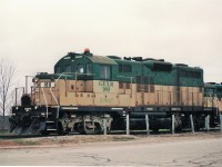 On a dreary April day Goderich & Exeter GP9 #180 "Falstaff" poses by the roadway.