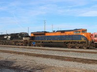 The Norfolk Southern Jersey Central Lines SD70ACe heritage unit at Agincourt Yard awaits pick up to head out on Train 147 in the afternoon. It is coupled to NS C40-9W 9917.