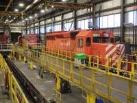 A pair of SD40-2's that are to be put into service occupy track 5 in the shop. The 5871 and 5878 behind it had originally been up for sale.