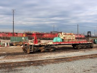 With work resuming on the scrapping of 5824 today,the engine and main alternator (green tarp) are left alone on the frame with part of the handbrake assembly attached. On the front of the frame can be seen an amount of sand that spilled out from the sandbox when the nose was removed.