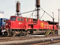 A MAC90 by the sanding towers at the east end of the shop. The Sand house (white structure) visible to the left of the 9147 behind the blue unit and the two sanding towers in this photo are but a memory now.