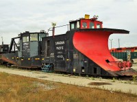 Canadian Pacific stenciled snowplow 401028 and CP Rail Jordan spreader 402894 parked on RIP track #R10 east.