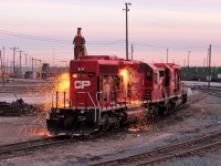 Two "torchmen" are busy prepping CP 6602 for dismantling, while one cuts off hinges to the doors on the engineer's side the other is in the rear of the engine compartment cutting specific areas so the rad section can be lifted off in one piece.