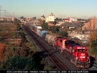 SOO Line SD60 #6052 leads an eastbound through the siding at Walkerville (Windsor), Ontario back on the morning of October 23, 2005.  I miss the SOO units as well as the SD40-2's like the trailing unit.  Never thought that I would ever say that after seeing SD40-2's on parade during the 80's and early 90's.