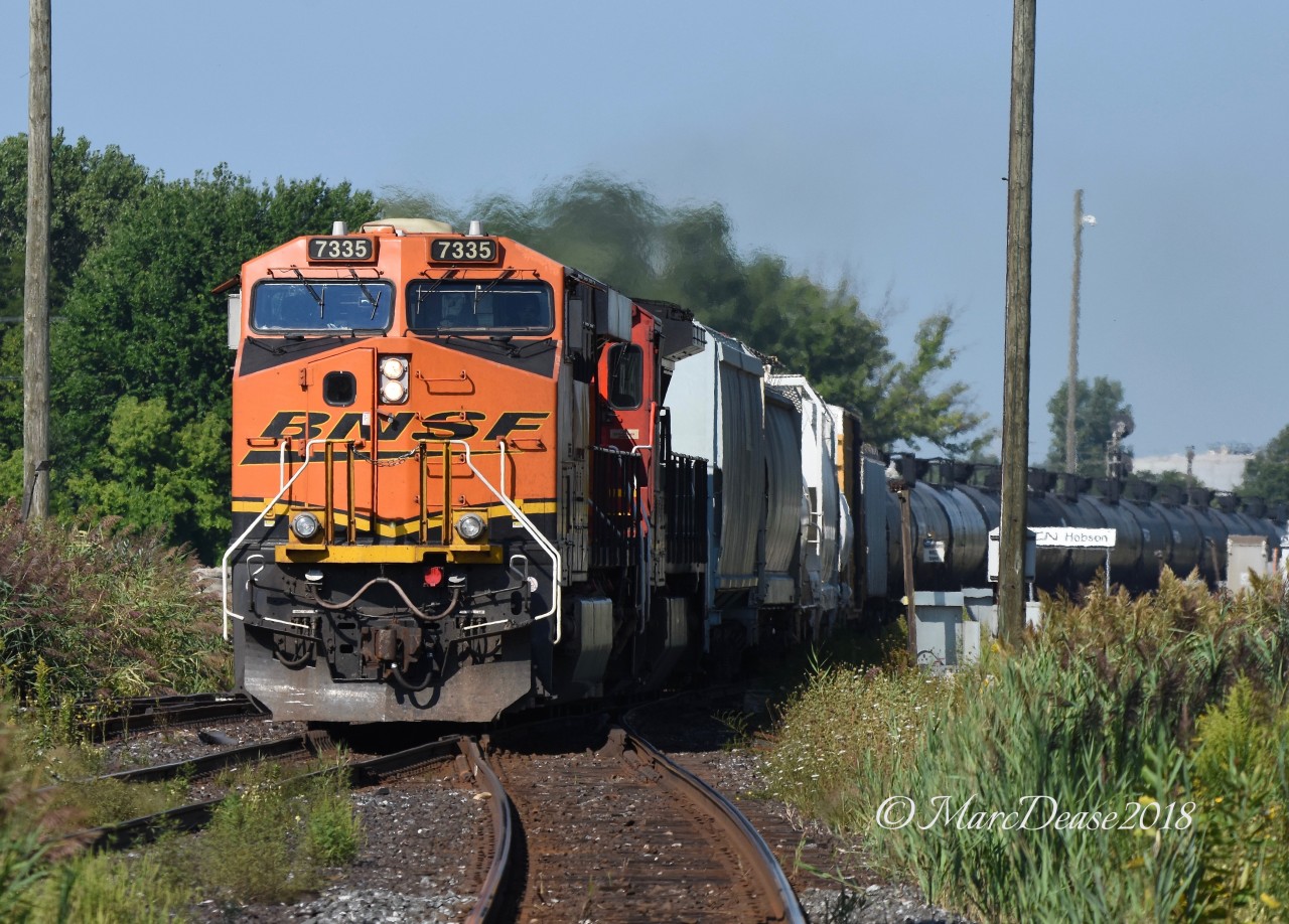 It's not unusual to see something foreign on train 504 but I was surprised when it was an actual BNSF unit and not a leaser. BNSF 7335 with CN 2108 roll by Hobson inbound for Sarnia.