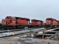 SD40-2 CP 5922 in trailing position as ballast train heads out with SD30eco 5012 in the lead. SD's 5945 & 5906 sit parked on track 1 west.