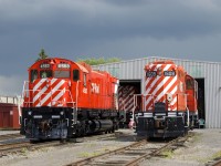 M-630 CP 4563, C-424 CP 4237 (inside the hangar in the background) and GP9 CP 1608 all display what some have dubbed 'candy cane stripes' as they get a bit of sun at Exporail on a mostly cloudy day.