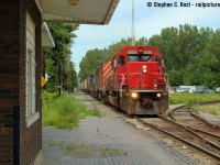 I offer this photo of now abandoned railroading, picture yourself standing on the platform at Chatham Depot as D725 arrives from Sarnia with 82 cars at 1301.<br><br>It was old school railroading on the CSX Sarnia division, the place was a time capsule where not much had changed and daily activities often went unrecorded, but we heard rumours of change coming - I was the type of fan to go to a spot and watch trains pass, not much for chasing, but this changed everything - armed with a single camera and my 50mm lens I documented this action a few times before it all fell silent, with a place to stay in Sarnia it was easy for me. It was a long and slow chase for 70 miles at an average 15 miles per hour (Train on duty 0600, departing around 0700, Arr Chatham 1300) but the friendliness of the crews, easy invites into the air conditioned station at Chatham and soaking up the atmosphere little changed since the 70's was worth it. It's all gone now, mostly.<br><br>Here's some audio I recorded, including radio chatter and CSX's only Canadian RTC dispatcher out of Wallaceburg from the same day as this photo:<a href=http://steve.hostovsky.com/clearance_434_north.mp3 target=_blank> Clearance to CN 434 on CSX Sarnia Subdivision </a><br><a href=http://steve.hostovsky.com/d725_07152005.mp3 target=_blank>OCS clearance from a month earlier</a><br><br>Chatham's last CSX Train was in February 2006 and it fell to CN. The Wallaceburg RTC office closed in October 2013 when the line changed to rule 105 after the last train to Wallaceburg. Chatham's trying to sell the rail line now for scrap and still holds onto it after all this time.<br><br>P.S: Why Depot? This is what they called it - Sarnia crews used the American term "depot" to refer to their stations and still do today.