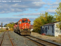 In the degenerate part of Kitchener (Beside Google) graffiti has taken over the former CNR MOW building at right while CN 540 reverses to the yard after working the CP interchange at Kitchener. The crew shoved in reverse all the way from South Jct to the yard affording me this angle in that nice low end of day light. Also no qualms about a standard cab gp38 on former GEXR Territory.. which is the norm with GEXR but somewhat rare on CN.

