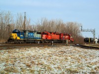 I arrived at Chatham chasing D725 south just before noon and was 30 minutes ahead of the southbound train, as I waited I noticed the outbound crew (D724) getting on the power to double onto their train and head north, but not until the inbound D725 yarded and sent the crew back to Sarnia in a taxi. What piqued my interest was a CSX unit heading back to Sarnia after 92 day inspection in the US, so I clicked a few pictures and this one turned out. I had plans to shoot the ETR in Windsor so I didn't chase north. Note the dwarf for the other leg of wye from CSX to CP. Oh to do this again.. there was a pair of CP GP9's just behind the CSX power in the CP yard.. I didn't even walk up to it for a close-up shot.