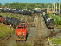 Sarnia's Plank Rd job has a SD40-2 in the lead as they drill cars into "A" Yard. Note the line of switches for the ladder track, but what about those two benches? Rest spots for a tired crew? I didn't notice this until later and find it a bit of a curiosity.