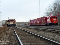 The CPR Holiday Train passing the MLW's of the Ontario Southland Railway at the west end of the Junction. Paying homage to the countries that host the CPR, Canadian and American flags fly proudly in the wind en-route to their first show of the day at the CPR Galt station in Cambridge.<br><br>For 2019 the first show was today in Montreal, and to those attending, don't forget to bring a donation of canned goods or money for the local food banks in your town. See this link for the 2019 schedule. <a href=https://www.cpr.ca/holiday-train/canada target=_blank>https://www.cpr.ca/holiday-train/canada</a>. Tell your family and friends to attend, it's a great time!