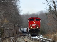 T'was the night before Christmas, not a creature was stirring, not even a mouse.  Until CP 7006 west came barreling through Campbellville like a bat out of hell - the fastest train I've EVER seen go up the grade and that includes light power! This was a 40 car train too. Talk about wanting to get home on time for Christmas (I don't blame the crew one bit). According to the RTC 246 had power problems (again) but managed to get going and gave the hill the show it hasn't seen in a long time. To boot - this train sounded nothing short of amazing, with the new EMD product in the lead, 3063 trailing and a GE of some kind in third, EMD was surely the dominant sound.<br><br>On that note - Merry Christmas from my family to yours - to all of our feller photographers, our volunteers who help make all these great photos get posted (all the back room photo editors, photo scanners, information/caption teams, moderators, database team, and social media butterflies) - all the railway employees in and outside the cab - and to all our viewers and fans all around the world, thanks for a great year and here's to many more. Wait, what about our Significant others that miss us all so much :) I forgot them. Hint: it's time to spend some time with them if you can :) but if you really don't want to, we'll have your company here :) Beers are in the fridge. Cheers!