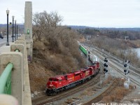 With 4 more to go to 1000 - Not a creature was stirring.. except a few Railfans eager to capture a new rebuild SD70ACU (former SD90) in the lead before Christmas festivities. I chased this nice 246 but given their speed at <a href=http://www.railpictures.ca/?attachment_id=39816 target=_blank>Campbellville approaching the Jct</a> I opted to head straight for Hamilton and spend time on the slower track down the mountain where I could bang off a few shots. This angle off the York Rd bridge really shows off the matching beavers of the first and second units - 3063 looks nice beside 7006. Also another note is the GO CN/CP connector tracks, the 'south' track was recently reconnected after track re-alignment - the rarely used North connector was finally put to good use after many years of what seemed like nothing (since the freights came off the Oakville sub joint section that is). Not sure the exact reason why two connectors were built nor why one was rarely used, but it paid off for the triple tracking project here.

