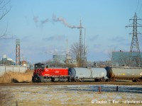 So after this LTEX unit <a href=http://www.railpictures.ca/?attachment_id=40078 target=_blank> came to the fence </a> only to retreat back into the plant, I waited to see if they would switch anything. Using my telephoto and some elevation I was able to capture this angle of LTEX 1014 working  Oxy Vinyls Niagara Falls/Thorold plant (It's on the border, I really don't know where to place this). This place was apparently built in 1957 and expanded 7 times. Parts of Niagara remind me of Sarnia with all the chemical companies, but no one bothered me while taking photos here - which would be unheard of in Sarnia.

