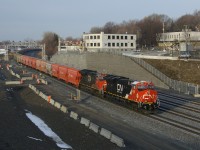 Loaded potash train CN B730 is slowly approaching Turcot Ouest where it will change crews. This heavy train has 205 cars and CN 3247 & CN 3012 up front, CN 3876 mid-train and CN 3002 on the tail end.