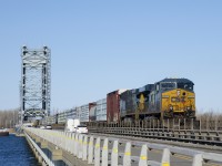 CN 327 with CSXT 5292, CSXT 414 and 81 cars is crossing the Larocque Bridge over the Beauharnois Canal, which the CSX track here shares with Route 132. 