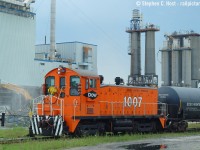 While Murray Demolition takes down the former Royal Polymers plant in Sarnia, VIP Rail's recently acquired DOW 1007 is switching VIP's yard . This unit would get paint not too long after this photo. <br><br>The recession of the late 2000's was not kind to Sarnia, Dow closed that spring (hence why 1007 was transferred - sold to VIP) and the Royal Polymers site along with dow met the demolition torch and nothing has replaced those sites to date. They are both empty. CSX and CN both got a lot of traffic from both plants.