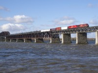 CP 253 is crossing the choppy waters of the St. Lawrence River on a windy morning with CP 8836 and brand new rebuild CP 7035 trailing.