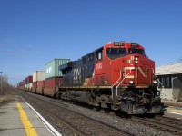 A late CN 120 is passing through Dorval with CN 2842 up front and CN 2905 mid-train. Soon it will enter Taschereau Yard, where additional power and cars will be picked up before it departs for Halifax.