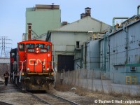 Trains are large - witness the CN employee to left of 1408 as the crew grabs a cut of cars out of the interchange track at Ottawa St in Hamilton. But Steel Plants are larger - Dofasco's aging facility hosts the no1 and no2 galvanizing lines at right amongst other operations. Photographed near dusk on a late March day.<br><br>
I know these are interesting and difficult times for most - if you do go out please practice appropriate physical distancing and now is not the time to take friends on a road trip. (This is likely Illegal if you are not domiciled with them!). With many people especially our older friends confined to their homes I'd like to think this site is providing a small form of entertainment for many of our fans. Also since our routines have been obliterated and many of us are finding us with more free time, we're happy to see more people scanning and organizing their collections and some even joining us on this site and sharing a few photos. Let us know if you are thinking of sharing but need help - we're here to assist where possible.  Lastly, please stay safe, keep your distance and remember, we'll all get through this together with our health! The chairs are full for the slideshow boys and girls, let's have some fun.
<br><br>
- Steve