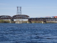 Both CP 253 and EXO 78 are northbound over the St. Lawrence River on a sunny morning.