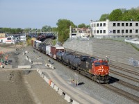 Normally through Montreal overnight, a very late CN 306 is approaching Turcot Ouest where it will change crews. CN 3863 is up front and CN 2874 is mid-train.