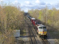 CP 253 with SD70ACU's CP 7010 and CP 7002 is passing North Jct on a cold morning.