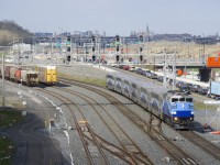 With the Mount Royal tunnel closed since Friday evening (for at least three years as it gets reconstructed for the REM light rail project), some trains on the Mascouche line are now taking a lengthier route which sees them go through CN's Taschereau Yard and then take CN's Montreal Sub to or from Central Station (some trains are starting or terminating at Ahuntsic Station, where passengers can get to a Metro Station). Here the second departure of the afternoon from Central Station for Mascouche is passing Turcot Ouest with F59PH AMT 1348 and six multilevel cars. This new routing adds 40 minutes to the trip from downtown to Mascouche.