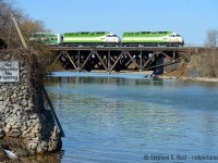 A matched pair of Tier 4, Cummins powered MP54AC's charge this eastbound GO train on the Lakeshore Line (MX Oakville Sub) across the reverse truss bridge at Port Credit that has fascinated me. It's certainly been there a long time and surprisingly untouched after all the infrastructure upgrades by Metrolinx! See these photos by Bill Thomson such as <a href=http://www.railpictures.ca/?attachment_id=30990 target=_blank>This in 1964</a> or this <a href=http://www.railpictures.ca/?attachment_id=40230 target=_blank>shot of a train that fits on it in 1981</a>. I bet some of the same Graffiti is still on it.