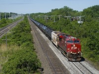 CP 8954 leads ethanol train CP 650 over a freshly ballasted section of the Vaudreuil Sub. Pushing on the rear is CP 8001.