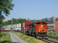 After having to hold west of St-Henri for over an hour while a signal maintainer did some emergency work at Pointe St-Charles, a very late CN 148 with a pair of SD70M-2s for power (CN 8875 & CN 8880) is on the move towards the Port of Montreal. As soon as CN 148 is done with this power, CN 149's crew (on-duty and waiting a couple hours at this point) will use this power directly from the port.