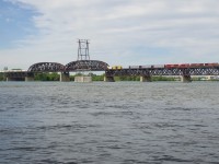 The second unit lets out some smoke as CP 253 crosses the St. Lawrence River with CP 8761, CP 9755, CP 2257 & CP 7038 for power.