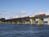 CP 651 has CP 8918 and military unit CP 7020 as it crosses the St. Lawrence River with ethanol empties from Albany. 