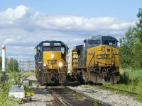 CSXT B786 at left is backing up with a single hopper to put onto its train before departing Beauharnois. At right is CSXT 474, which was power on CSXT B762 from Massena.