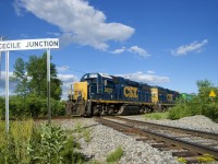 CSXT B786 is backing up over the diamond at Cecile Junction as it works the CN interchange. The train is on CN's Valleyfield Sub, with the CSXT Montreal Sub crossing it at grade here. Power is CSXT 2622 & CSXT 6095.