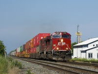 A short CP 119 races through the town of St-Clet with CP 8019 & CP 8610 for power. At right a feed mill stood until it was demolished two years ago.