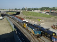 Since the start of the pandemic, VIA 601/603 to Northern Quebec has only been running once a week (versus its regular schedule of three days a week) and for the past few weeks it has left Montreal around sunset (its normal departure time from Central Station is 0815). Today's train left at 1715, putting it in good light while it was on CN's Montreal Sub. Here it passes a short CN 527, with VIA 6418 & VIA 6416 up front and VIA 6411 leading the VIA 603 portion of the train.