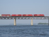 A trio of fresh SD70ACU's (CP 7054, CP 7045 & CP 7055) lead a 140-car CP 253 over the St. Lawrence River. They had been delayed a bit south of here when a hotbox detector on CP's Lacolle Sub warned them of a problem.