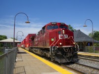 CP 112 with CP 8147 up front and CP 8770 at the rear (and a 100% intermodal train in between) is passing Valois Station. 