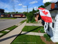 While we can't enjoy the many fireworks this year, perhaps a little alco smoke will tide us over. Engr. Snook is heavy on the throttle as Ontario Southland is heading back toward home after a day of switching in the north end of Guelph, with a little alco smoke passing some of our town's Patriotism.  Happy Canada Day everyone!

