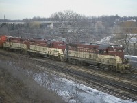 For reasons I can only speculate; I am up on the ridge at the Royal Botanical Gardens parking lot rather than down in the Jct lot below. Maybe it was damp, cold, and windy. Sure looks like a typical February afternoon.
Anyway, nice to catch an all TH&B Starlite rolling thru from Toronto on its way into Hamilton. The power is TH&B 77, 76 and 73. Sure miss this road. Little did I know it had less than 10 years left.