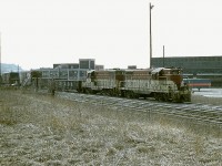 When I looked at this shot, it reminded me of how "some days are like this".  A hazy nondescript sky, everything a monotonous brown. The sky, the foreground and even the locomotives.  Not much to break up the colours of this image. The scene is of TH&B 71 and 74  with a local heading out of the Aberdeen facility, destination unknown, or rather, forgotten.