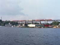 There are a lot of Parry Sound bridge pictures out there. But unless you have actually been there, it is hard to image by photo how big this trestle really is. It spans 1697 ft crossing the Seguin River, and most of the structure is visible in this shot taken from quite a ways out. The 1908-built landmark is impressive indeed.  On this day, it is getting close to sundown as CP 5549, HLCX 3066, and CP 5694 as train #474 thunder southward en route to Toronto. 
These days, this is part of a shared asset zone, with trains CP and CN running only northward here; and running southbound over the CN line which wanders thru the downtown.