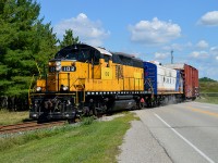 The former Essex Terminal #102, now on OSR, is out for what I believe is only its third run with it's new owners, on a beautiful Friday afternoon. It is shown here crossing Putnam Rd heading down toward St. Thomas. The F unit is #1400 and there is only one car in tow.  In the background you can see the Hwy 401 overpass.