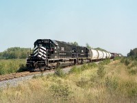 Try as I may, I just could not quite pin-point the location of this shot. So, took a stab at it. Belledune.
The Matapedia & Gulf Railway was only in business under this name from 1998 to 2008. On Nov 3, 2008, CN purchased NBEC (New Brunswick East Coast) and the CFMG as well as the Ottawa Central in Ontario and a small road at Matane, Quebec from the Quebec Railway Corporation and that was it for the CFMG.
Second unit behind 6903 is 6909. These SD40s were previously CN 5057 and 5070, acquired in 1999.