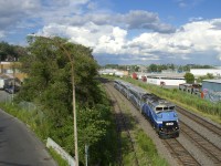 With quite a large number of clouds in the background, EXO 1211 heads west with AMT 1345 leading. A large thunderstorm would develop about an hour and a half later.