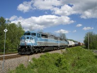 After having to take it slow due to CP's bridge over the St. Lawrence Seaway being raised, CP 253 with CMQ 9023 and CMQ 9022 for power is pouring it on, with the signal at Adirondack Jct showing a clear aspect.