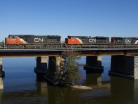 CN 369 has a trio of EMD's (CN 5700, CN 8014 & CN 5668) as it crosses the Ottawa River on the north track of CN's Kingston Sub.